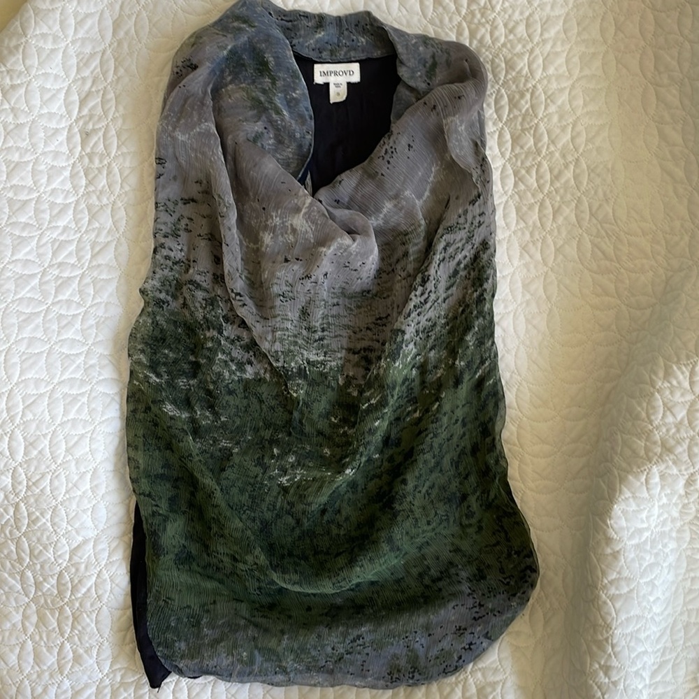 Light comfortable sleeveless summer blouse.